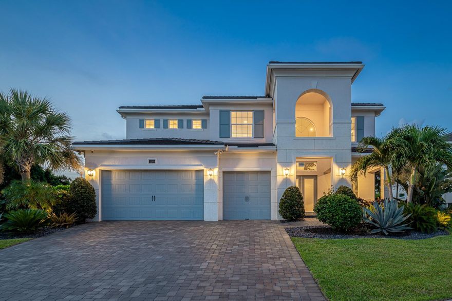 A SANCTUARY - UNPARALLELED COASTAL LIFESTYLE WITH DEDICATED MARINA SLIP FOR EACH HOMEOWNER Just Reduced $75,000. Perched over 30 feet high on a bluff with sweeping views of the St. Lucie River and year-round breezes, this stunning custom CBS home with a classic tile roof is the pinnacle of a rare blend of contemporary comfort and refined luxury waterfront living.  Situated at the end of a quiet cul-de-sac in the exclusive waterfront gated community of Langford Landing, this 2021-built residence offers 5 bedrooms and 5.5 baths spanning approximately 4,300 square feet of thoughtfully designed living space on a beautifully landscaped 0.35-acre lot with a beautiful preserve behind the fenced yard.The 4 spacious guest bedrooms, (SEE SUPPLEMENT)