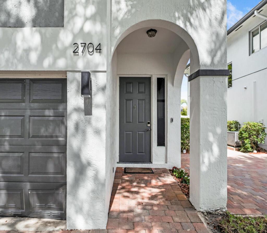 Welcome to your dream home in the sought-after Treasure Cove Yacht Club! This beautifully updated residence features fresh paint and new laminate floors, perfectly situated near the intercoastal with ocean access and a private boat dock. No membership making this boating community even more appealing. The kitchen is a chef's delight, showcasing custom wood cabinets, brand new quartz countertops, new stainless steel appliances. Enjoy peace of mind with a 2019 AC and water heater. Unwind on the lovely rear deck, crafted from composite material in 2022. The elegant master suite boasts brand new laminate flooring, spacious walk-in closet, marble countertops, soaking tub, walk-in shower, dual vanities, and a new bidet. A versatile loft area serves as an office or easily converted to 4th bedroo