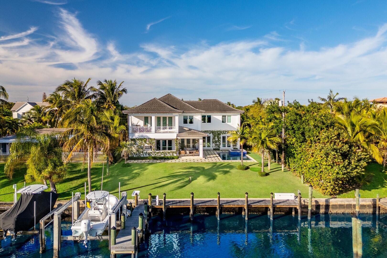 Beautiful 4BR/5BA Waterfront SoSo home built in 2015. 50'+/- marginal dock with 20,000+/- pound boat lift and power pedestal. Gorgeous open floor plan highlights water views throughout. Stunning hardwood flooring and custom millwork. Lyme-washed tongue and groove cypress ceilings in dining room, primary suite, loggias, and balconies. Louvered mahogany front doors, side gates, and garage doors. Impact windows and doors throughout. Modern home automation, including audio/visual, HVAC, lighting, and pool equipment. No detail has been overlooked in this gorgeous home. Lush tropical landscaping, romantic landscape lighting, and Dominican coral hardscape. Fantastic outdoor living with balconies, putting green, pool, spa, and fabulous loggia featuring summer kitchen.