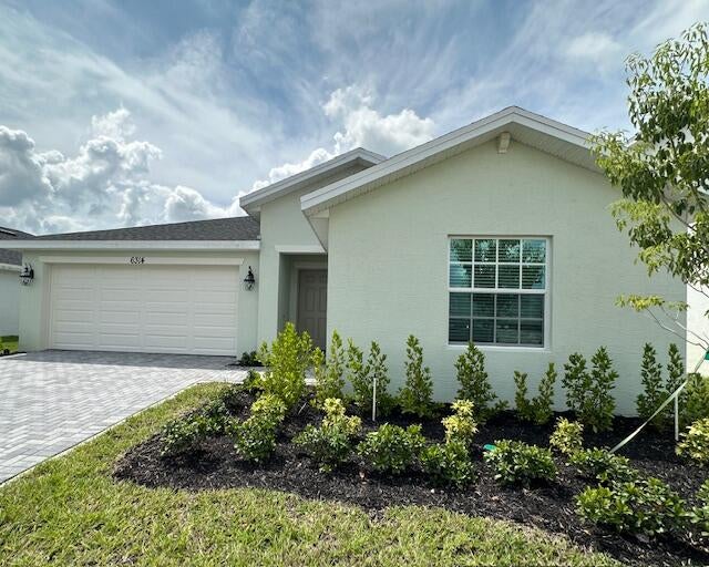 Photo of 6314 NW WINDWOOD Way, Port Saint Lucie, FL 34987 (MLS # B26072523)