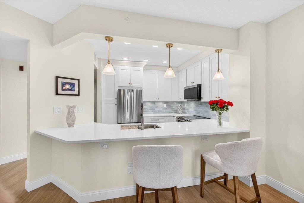 Photo of 400 Uno Lago Drive #103, Juno Beach, FL 33408 (MLS # R11169547)