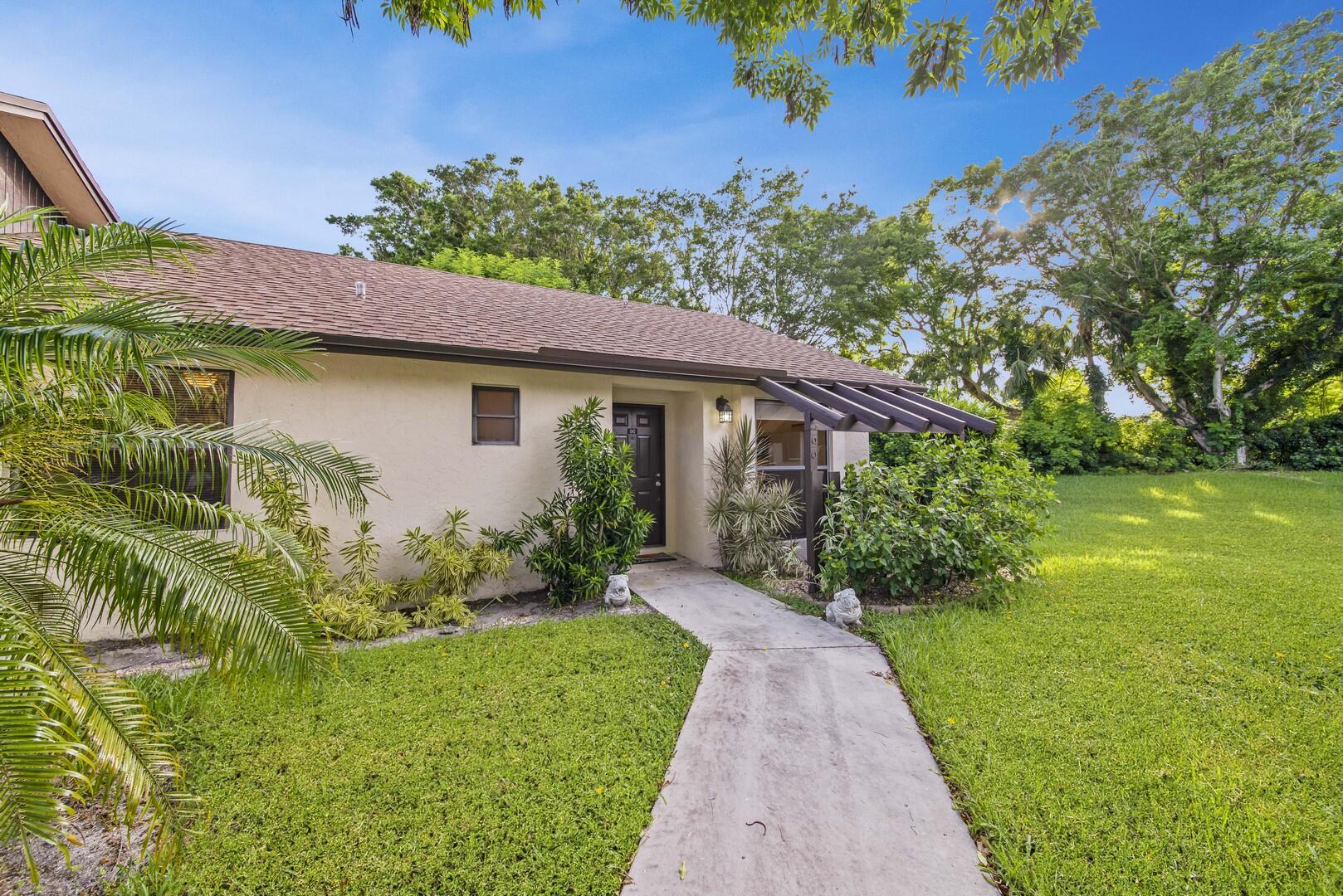 Come experience the active Florida lifestyle in this charming 2 bedroom, 2 bath villa. Open floor plan with neutral tile through out, no carpets. From the moment you enter you will notice the vaulted ceiling, and the abundance of natural light. The kitchen features plenty of cabinet and counter space and a large window for tons of natural light. The master retreat with a slider to the patio, a walk-in closet and en-suite bath. The spacious screen enclosed patio is the ideal space to entertain friends or just enjoy a quiet evening. This end unit home has been freshly painted and is move in ready. Tradewinds features first class amenities that include a clubhouse, resort style pool and tennis. Tradewinds at Dos Lagos is located close to shopping, dining, entertainment and major highways.