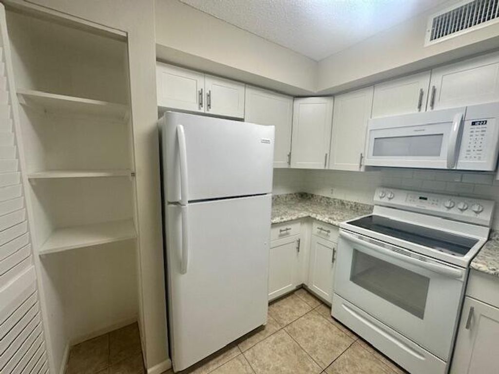 Photo of 7840 Sonoma Springs Circle #103, Lake Worth, FL 33463 (MLS # B26022563)