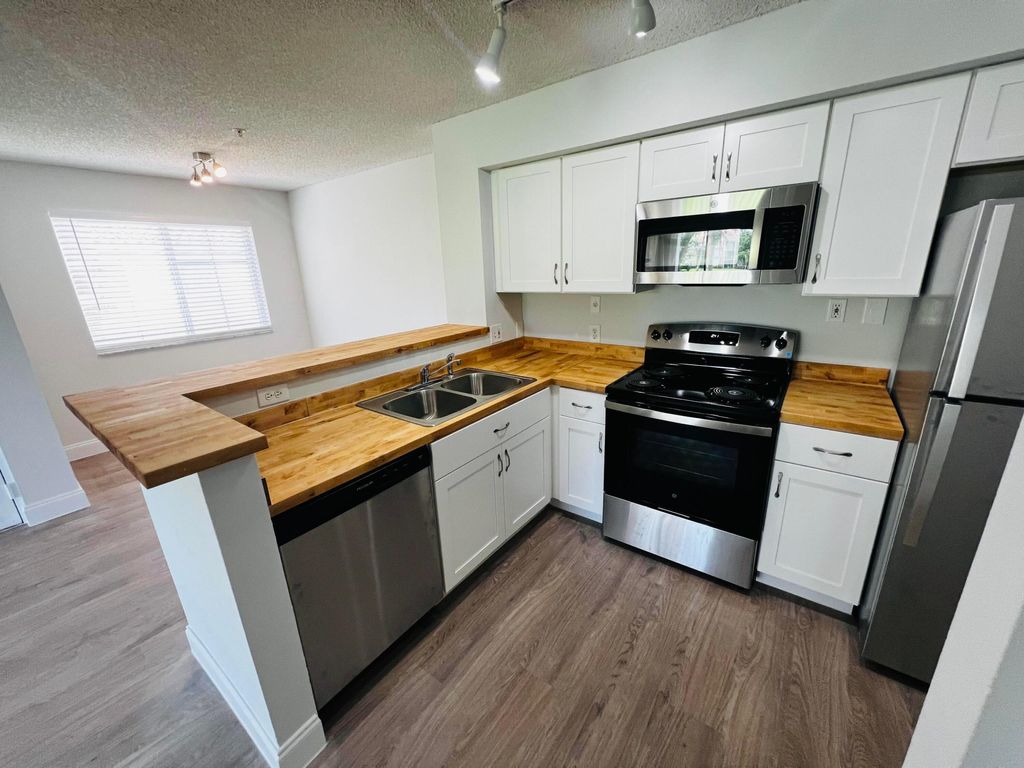 Photo of 7840 Sonoma Springs Circle #208, Lake Worth, FL 33463 (MLS # B26018498)