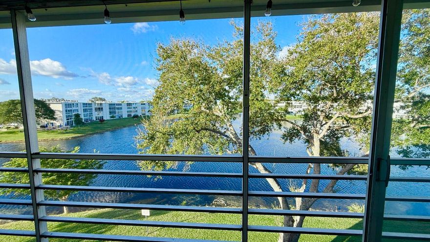 Spectacular LAKE VIEWS from every window & enclosed Patio. CORNER  2 Bedroom, 1.5 Bath 860 SF. ROOF Replaced 2025. LOW MONTHLY HOA FEE! Replaced AC, Smart Thermostat Ecobee & Garbage Disposal 2025. Hot Water Heater 5 years. Kitchen has Water Filtration. Freshly PAINTED 2025 walls & ceilings. Patio with tile flooring & sliding doors for protection. Come see what this condo has to offer. It is ready for you to make it your Own. The main Clubhouse has Indoor & Outdoor Pool, Restaurant, 1600 Seat Theater, Clubs, Classes, Billiards, Tennis, Pickleball, Volleyball, Ping Pong, Bocce Board, ShuffleBoard, Fitness Center, Hiking Trails, Putting Green, Bike Trails & more. Close to Beaches, Entertainment, Dining, Shopping. Association claims 55+ community. Approval required