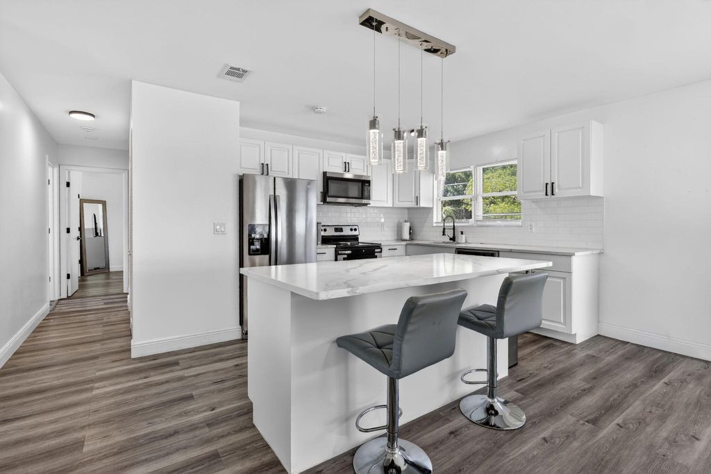 Photo of 161 SW Dalva Avenue, Port Saint Lucie, FL 34984 (MLS # B26016602)