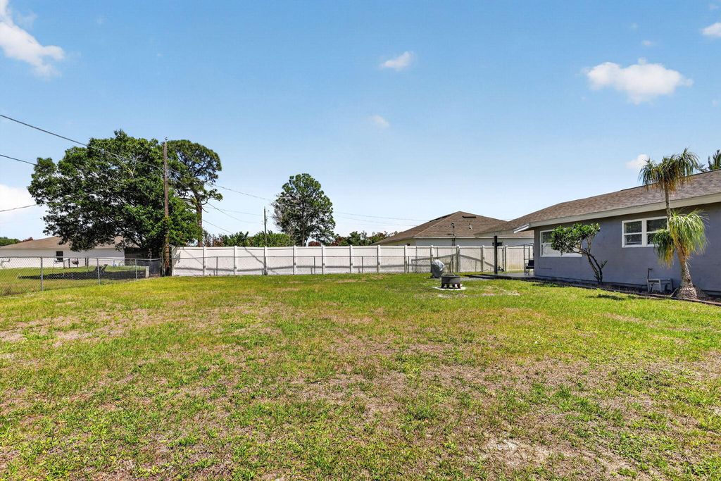 Photo of 161 SW Dalva Avenue, Port Saint Lucie, FL 34984 (MLS # B26016602)