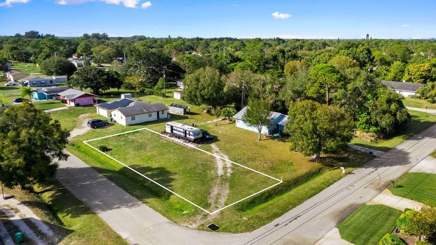 Peaceful rural corner lot in Fort Pierce offering a quiet setting while still close to schools, shopping, hospital, boat ramps, public parks, and beaches. Recent Survey Available.
