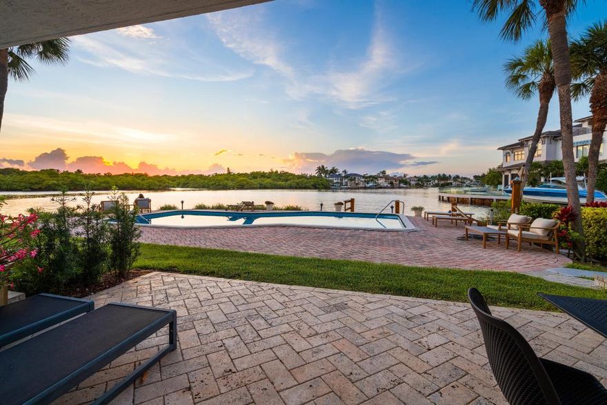 Welcome to Lloret De Mar, your private coastal retreat in the heart of Highland Beach. This waterfront townhome offers direct beach access just across the street, boat dockage, a pristine pool, and breathtaking Intracoastal views. The open-plan living area flows to a waterside patio with a built-in grill, perfect for entertaining. Inside, enjoy a chef's kitchen with custom birds-eye maple cabinetry, Canadian maple hardwood floors, two spacious bedrooms plus a versatile third room with a Murphy bed, and a luxurious primary suite with soaring ceilings, two private balconies, and a sunlit loft terrace ideal for a dressing room, office, or yoga space. Additional highlights include a one-car garage, 2023 roof, and freshly painted exterior. Ideally located near Boca Raton, Delray Beach, and Palm Beach, this residence offers the pinnacle of waterfront townhome living with seamless access to world-class dining, shopping, and entertainment.