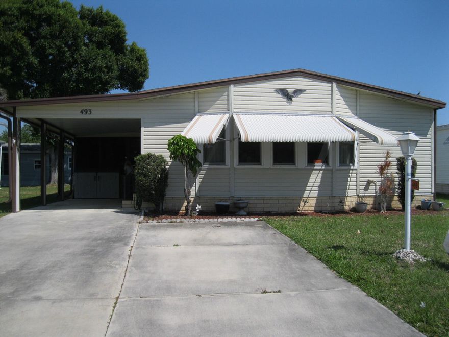 Spacious and well maintained  2 Bedroom 2 bathroom mobile home located in the desirable 55+ community of Tropical Isles. Open floor plan design with bamboo flooring, amazing Florida room, attached shed and newer A/C. Beautiful Community offers amenities such as a club house, pool and social activities. Make your appointment to see this lovely home today.