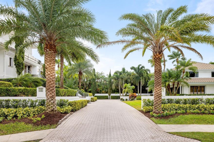 Situated on a coveted 0.81-acre double lot within the prestigious Boca Grove Country Club, this magnificent estate represents a private compound of unparalleled elegance. Comprising four individual structures, all seamlessly united under one single club membership, the property boasts a distinctive mid-century Italian modern motif that captivates upon arrival.Upon entering the copper and stainless steel ornamented main residence (7,641sf) located on the second floor, a grand spiral staircase elegantly connects all three levels of this thoughtfully designed construction. Designed for both extravagant entertaining and privacy, the property features an owner's primary suite on the entire third floor.  SEE MORE..