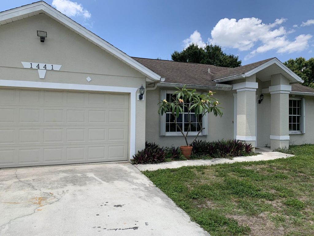 Photo of 1441 SW Medina Avenue, Port Saint Lucie, FL 34953 (MLS # R11093110)