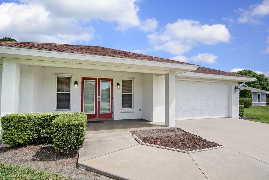 Tucked away on a peaceful half-acre lot just minutes from the heart of Okeechobee, this 2-bedroom, 2-bath home offers a comfortable, easygoing feel with room to spread out. The open living and dining areas flow into the kitchen and spacious family room, creating a natural gathering space. The kitchen features matching appliances (2018) and ample storage. Bedrooms are set on one side for privacy, with two updated bathrooms (2020-2021) between them. Recent updates include laminate flooring (2024), interior paint (2024), exterior paint (2023), A/C (2024), water heater (2021), and new roof being installed this month. Hurricane shutters and impact glass on the front door and patio windows add peace of mind.