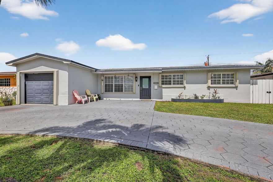 Fantastic 4 bedroom home in the heart of Pembroke Pines. New Roof!. Open kitchen. Upgraded bathrooms. Room for a pool. Complete Accordion shutters throughout. This home has a great layout for entertaining and enjoying all the extras of home ownership. Side fence opens to store a boat or RV. Near shopping and major roadways.