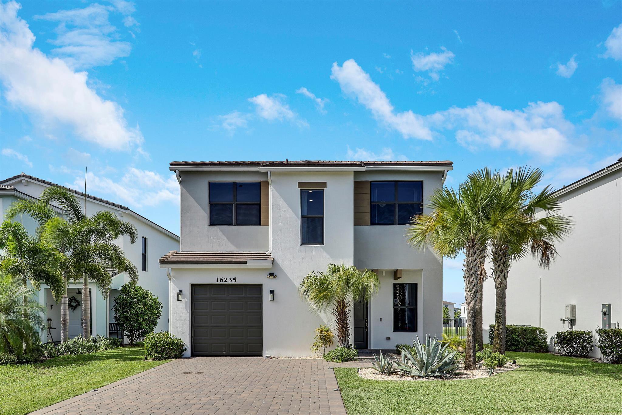 This beautiful 3-bedroom, 2.5-bathroom waterfront home combines comfort and style in a serene setting. Enjoy an open-concept layout with natural light, high ceilings, and modern finishes throughout. The spacious kitchen features stainless steel appliances, sleek cabinetry, and a large island perfect for entertaining. The primary suite offers a spa-like bathroom and generous his/hers closet space. Step outside to your screened-in patio overlooking the water--perfect for relaxing or hosting guests. Located in a vibrant community with resort-style amenities, top-rated schools, and nearby shopping and dining. This home has extensive upgrades, make it yours today!**Includes a dedicated Electric Vehicle Charging station**