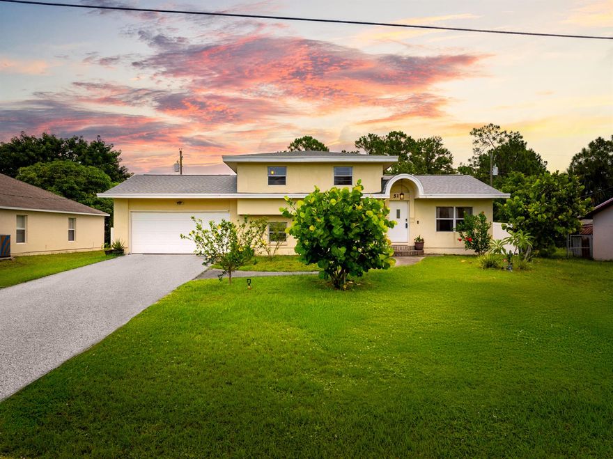 NEW ROOF!!Charming & Updated Home with Income Potential in Port Saint Lucie - No HOA!Discover this beautifully maintained 3-bedroom, 2-bath home with a desirable split-level layout and plenty of modern upgrades. Enjoy peace of mind with a NEW roof, NEW A/C, NEW water heater, updated electrical, and a tastefully updated kitchen.Step outside to your private backyard oasis featuring a brand-new white PVC fence and a bounty of fruit trees--mango, banana, pineapple, guava, and avocado--perfect for tropical living. The spacious yard offers room for a pool and a large private porch for relaxing or entertaining.