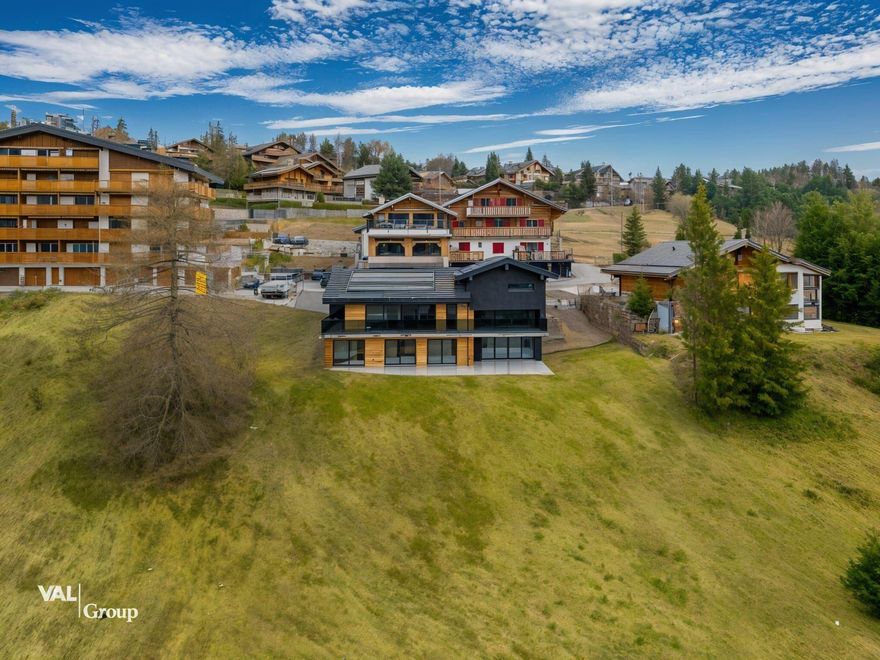 Whether you’re looking for a luxurious year-round home or a mountain retreat, this chalet offers unparalleled comfort, modern amenities, and access to one of Switzerland’s most desirable regions. 290 m² of living space as the main residence, 4 bedrooms and 4 bathrooms, including: A master suite with a mezzanine, perfect for an office or child’s room, each bedroom opens to a west-facing terrace with panoramic views. A spacious living area with an open kitchen (can be closed if desired) that connects seamlessly to a terrace or terrace garden. Two levels: ground floor and upper floor, constructed entirely of concrete with a wood finish, reversible heat pump for warmth in winter and cool air in summer, Solar panels on the roof, Two tiled garages with windows. Jacuzzi on the terrace.