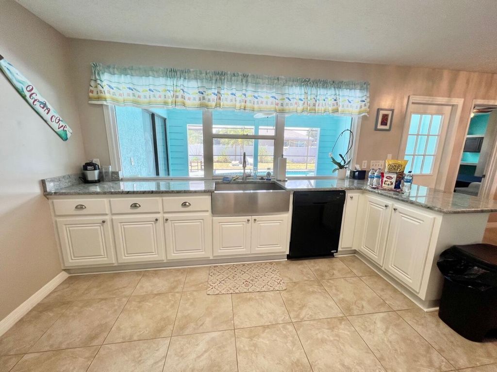 Photo of 1608 SW Ocean Cove Avenue, Port Saint Lucie, FL 34953 (MLS # R10994557)