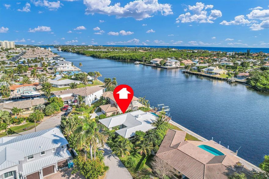 DIRECT INTRACOASTAL WATERFRONT home for sale. 3-bedroom, 2-bath, 1-story single family home, heated pool/spa, & a 14,000 lb. boat lift.Watch the passing boats from your private backyard in a peaceful, quiet neighborhood of East Boynton Beach. Large impact windows brings in the natural light & breathtaking water views. Enjoy the convenience of a 2-car garage, driveway, & ample off-street parking for up to 8 vehicles. Ideally located less than 10 minutes from the desirable downtown area of Delray Beach, minutes from top-rated restaurants, shops, & the ocean. Easy access to both West Palm Beach & Fort Lauderdale airports.Lee Manor Isle has NO HOA rules or fees, 1 entrance into this family-friendly neighborhood, & no drive-through traffic. Leased 2-Years. Some photos virtually staged.