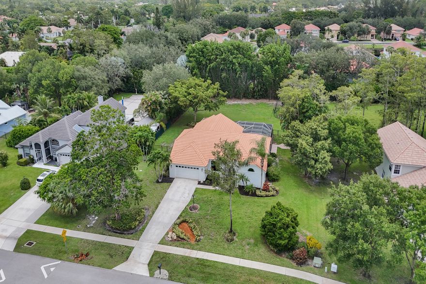$35,000 ROOF CREDIT. NEW: AC, IMPACT WINDOWS & CUSTOM KITCHEN WITH FARM SINK AND EXPANSIVE QUARTZ COUNTER-TOPS! A-RATED SCHOOL DISTRICT!  Welcome to Legend Lakes Estates. Spacious Well Appointed 1-story, 3-Way Split Bedroom Pool Home on .65 acres. As you step into the foyer you will be captivated by the Vaulted Ceilings and Spacious well Designed Living Space. New Tile Floors throughout the home. This Amazing Home features 4 generiously sized bedrooms 3 large baths - Cabana Bath which steps out to the Screened Covered Pool & Spa Area. Master Suite with Sitting/Office Space. Inside Laundry. Fully Fenced Yard w Sprinkler on Well. Low HOA fee of $125 mth includes pickleball, tennis, and basketball courts. Near Restaurants, Shopping, Mall, Airports, & Turnpike! See this Breathtaking home!