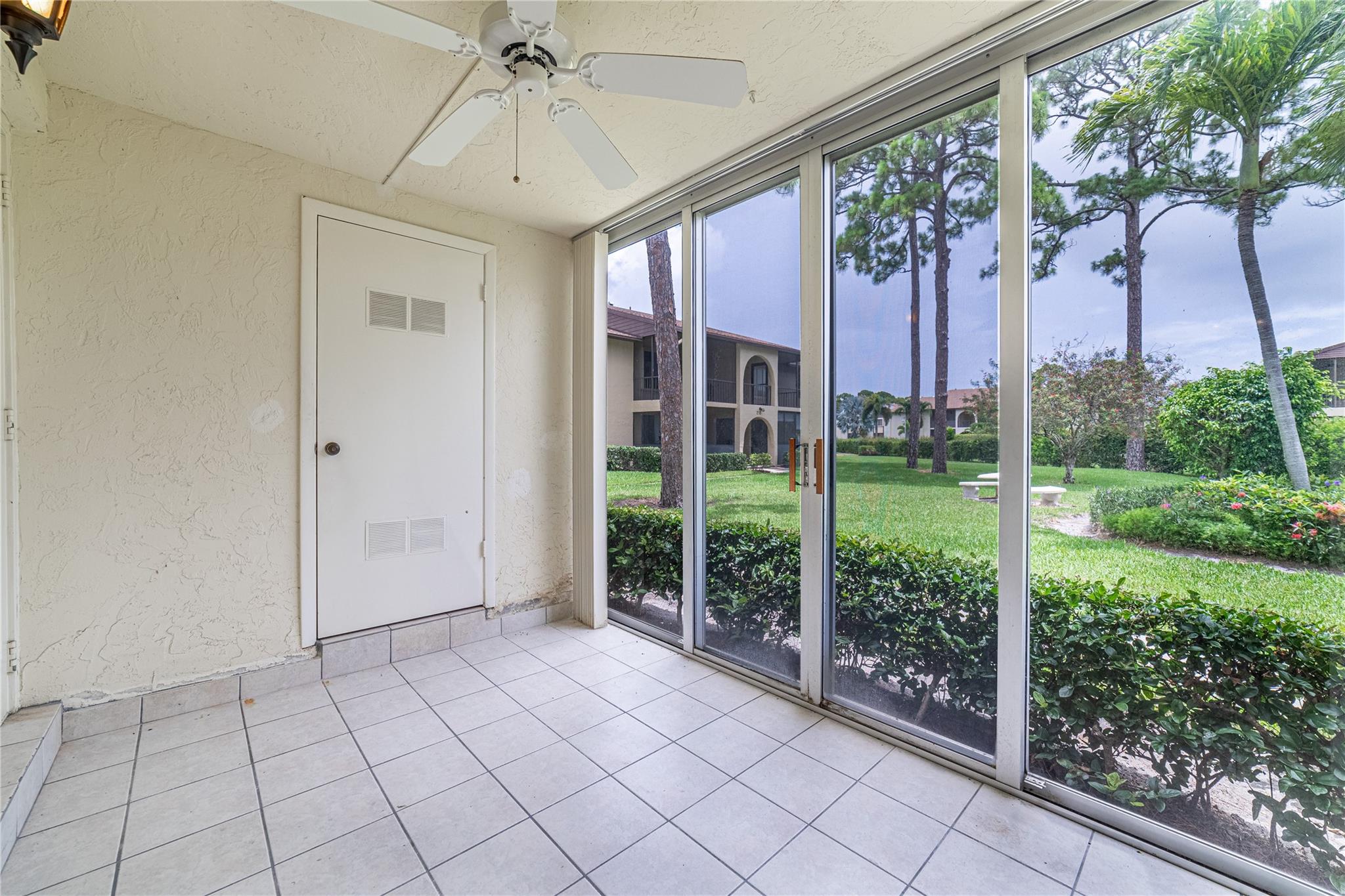 Ground-floor ease at Pine Ridge South II! This move-in-ready 2 BR/2 BA condo includes a glass-enclosed porch, tile living area, walk-in closets, newer bath vanities, and a 3-yr-old water heater, new stove, and newer windows in the bedrooms. In-unit washer/dryer plus private storage add convenience. Stroll across from Greenacres City Hall or a few steps to the heated pool, shuffleboard, and busy clubhouse; basic cable, roof, and building insurance are covered in the low fee. Quiet, lush, and minutes to shopping, dining, parks, and beaches. One resident 55+ (others 18+)