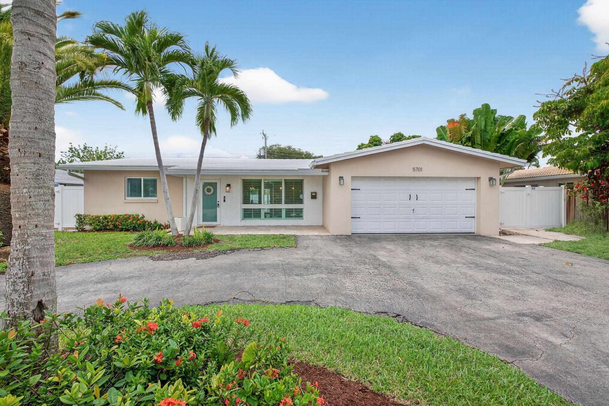 Welcome to this bright and beautifully updated home in the highly sought after neighborhood of Coral Ridge Isles! This 3 bedroom, 2 bathroom, pool home exudes natural light, offers an open floor plan and stunning kitchen. Enjoy the best of the south Florida lifestyle with a spacious backyard, perfect for entertaining and family gatherings all year round. With a whole house gas generator, full impact glass, a screened in pool with extended travertine pavers, newer PVC white fence, updated flooring and stainless steel KitchenAid appliances, this is it. Located just 3 miles to the Lauderdale-by-the-sea Beach, exquisite restaurants, shops, schools, and more. This is a special community you won't want to miss. Welcome home to 5701!