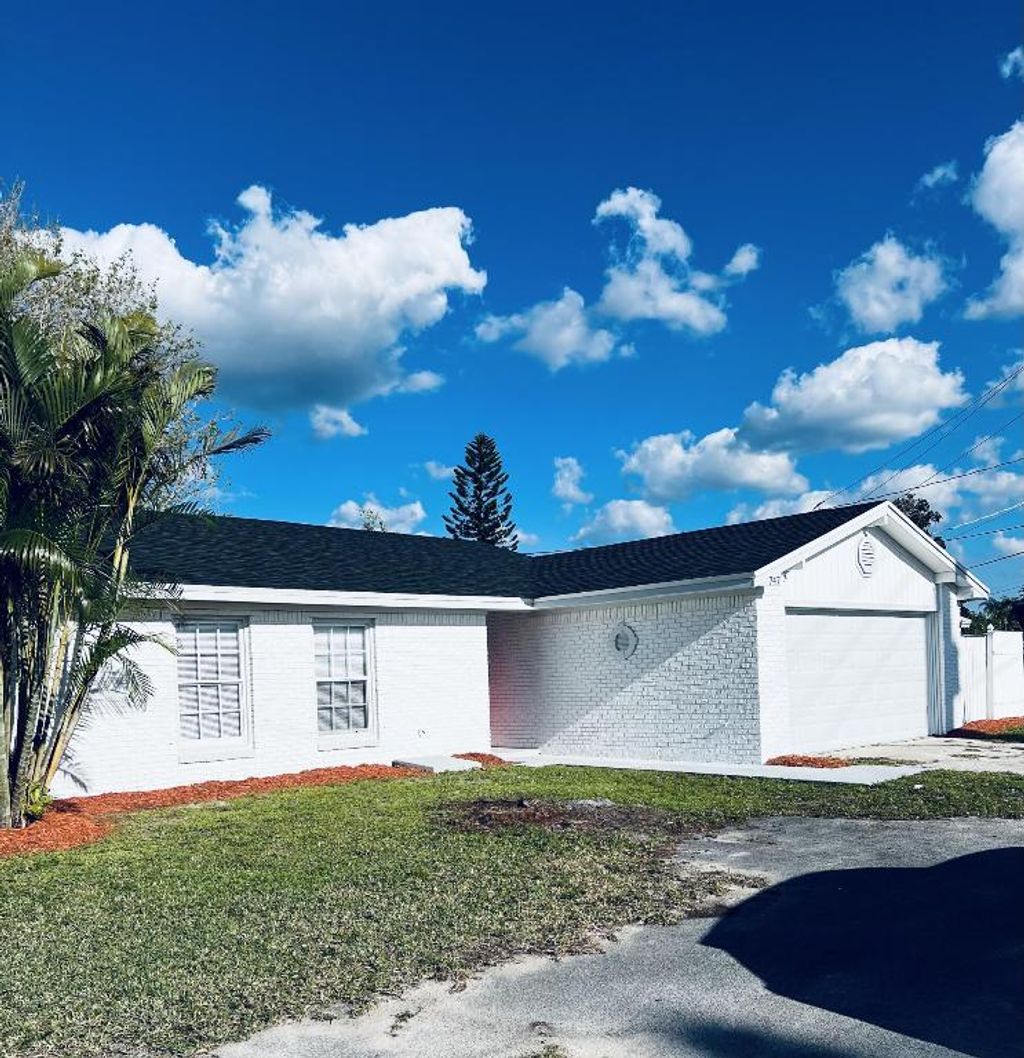 Photo of 747 E Prima Vista Boulevard E, Port Saint Lucie, FL 34983 (MLS # R10956361)