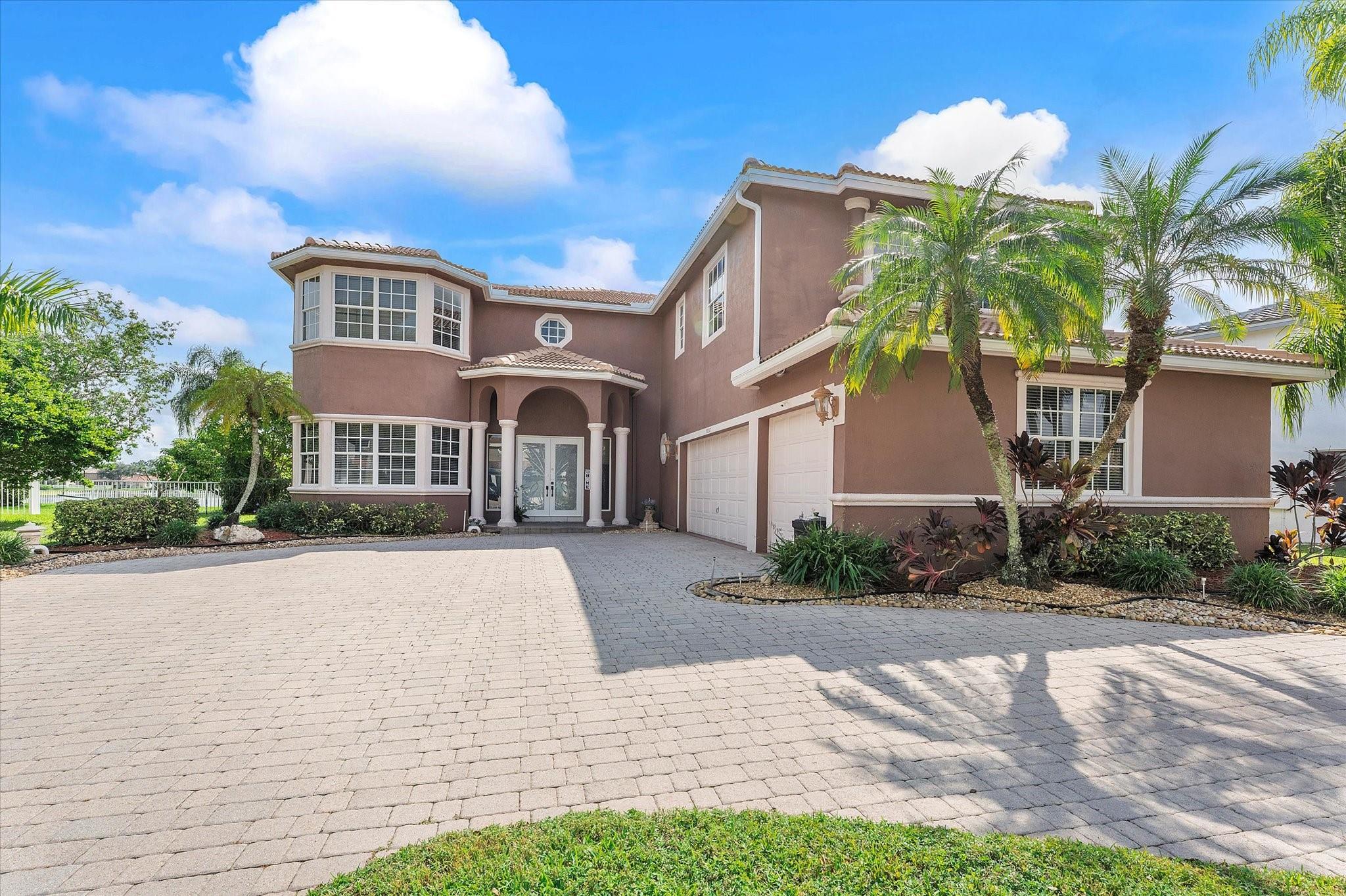 MOVE IN READY lakefront estate in the HIGHLY sought-after Grand Isles at Wyndam Lakes. The lot's positioning presents some of the most expansive lake views in the community. This spacious home features a 2024 Roof, 6 bedrooms, 4 & 1/2 baths, an office, a bedroom with an ensuite bath on the 1st level, formal living & dining rooms, and a 3-car garage. The well-equipped kitchen is open to the family room, has a great breakfast area & offers ample storage. Your OVER-SIZED Primary Suite has room for 2 sitting areas, a walk-in closet, & one of the largest ensuites you'll ever see. You'll love entertaining poolside on the pavered pool surround or under the covered lanai.