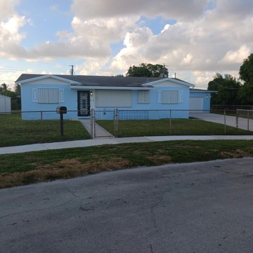 This is a beautiful property located in the heart of one of Miami Gardens most sought after residential communities.  It's comprised of 4 generously sized bedrooms, 2 completely renovated bathrooms, 1 large family room, a dining area, a well appointed kitchen and a huge laundry room.  The property has been totally transformed with all-new flooring, appliances, countertops, cabinets, kitchen and bathroom remodeling.  It's truly an HGTV model home in a neighborhood with long time residents that truly value the community.  Other amenities include centralized accessibility to various Miami-Dade and Broward venues.  A price increase is pending so please don't hesitate to capitalize on this Oasis in the Gardens.  Call now, will not last long at this price!!!  (+$200/month flat rate utility fee)