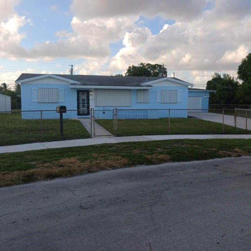 This is a beautiful property located in the heart of one of Miami Gardens most sought after residential communities.  It's comprised of 4 generously sized bedrooms, 2 completely renovated bathrooms, 1 large family room, a dining area, a well appointed kitchen and a huge laundry room.  The property has been totally transformed with all-new flooring, appliances, countertops, cabinets, kitchen and bathroom remodeling.  It's truly an HGTV model home in a neighborhood with long time residents that truly value the community.  Other amenities include centralized accessibility to various Miami-Dade and Broward venues.  A price increase is pending so please don't hesitate to capitalize on this Oasis in the Gardens.  Call now, will not last long at this price!!!  (+$200/month flat rate utility fee)
