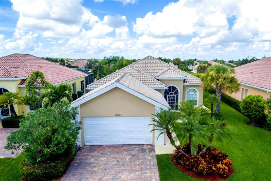 •This is the one you've been waiting for. Enjoy resort style living in this glorious gated community within Tradition Port Saint Lucie. This beautiful 2000 sq. ft. 3 bedroom, 2 1/2 bath quality DiVosta solid poured concrete home includes a Dining Room and office and has been fully renovated from floor to ceiling, featuring high-end fixtures and finishes throughout. This contemporary styled home offers 10' – 12' ceilings throughout with 8' solid interior doors, generously sized living and family rooms leading to enclosed patio and lake making this house perfect for entertaining.