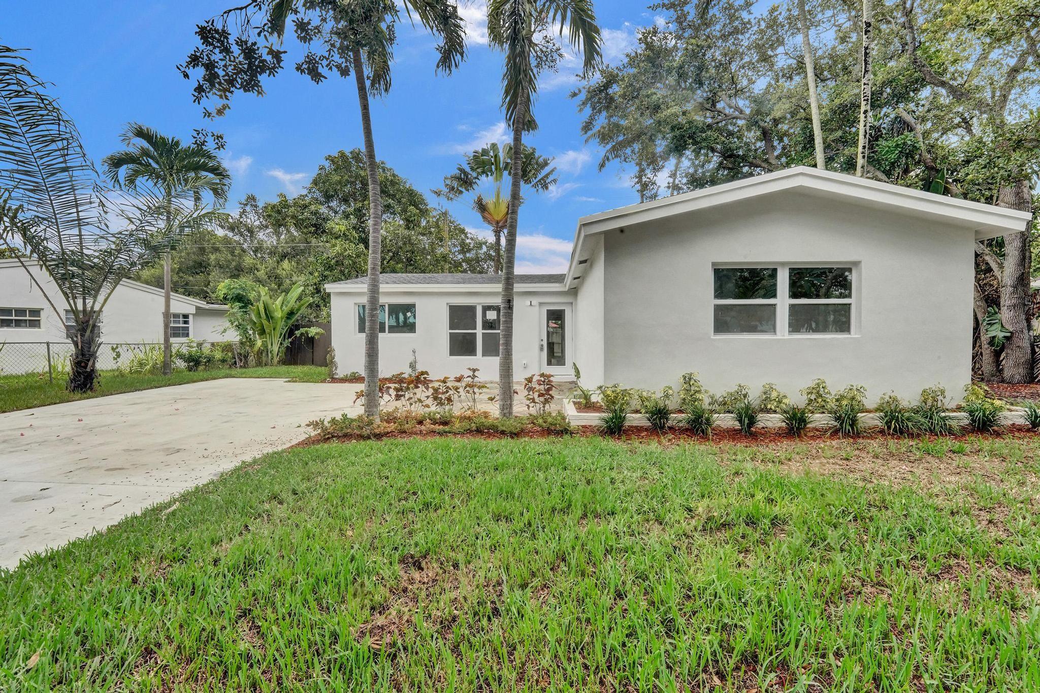 WELCOME TO YOUR FULLY RENOVATED OASIS IN THE HEART OF HOLLYWOOD! This delightful 4-bedroom, 2-bathroom home is nestled on a generous lot offering both privacy and convenience. Step inside to discover a sleek modern kitchen featuring brand-new stainless steel appliances. The home includes impact windows and doors, providing peace of mind and storm protection. The covered patio & spacious backyard are perfect for outdoor entertaining or relaxing. Natural light pours in throughout the home, highlighting the elegant tile floors. The expansive driveway provides plenty of parking for you and your RV/boat. Situated just minutes from the iconic Hard Rock Guitar Hotel, highways, FLL airport, and more, this home offers the ultimate location. Don't miss out on this fantastic opportunity—easy to show!