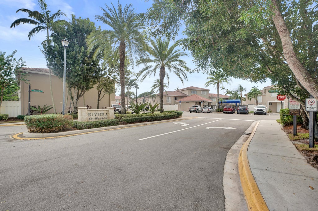 Photo of 235 Riviera Circle, Weston, FL 33326 (MLS # B26091691)