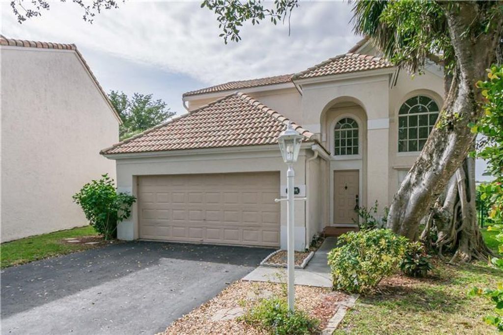 Photo of 7722 Hibiscus Lane, Coral Springs, FL 33065 (MLS # F10513364)