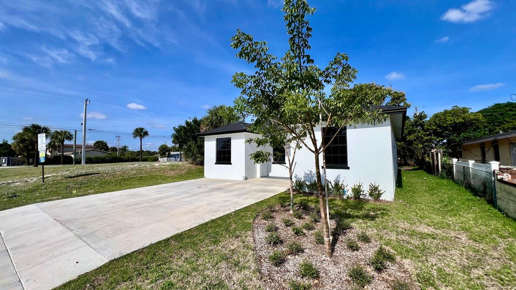Photo of 1580 W 32nd Street, Riviera Beach, FL 33404 (MLS # R11146045)