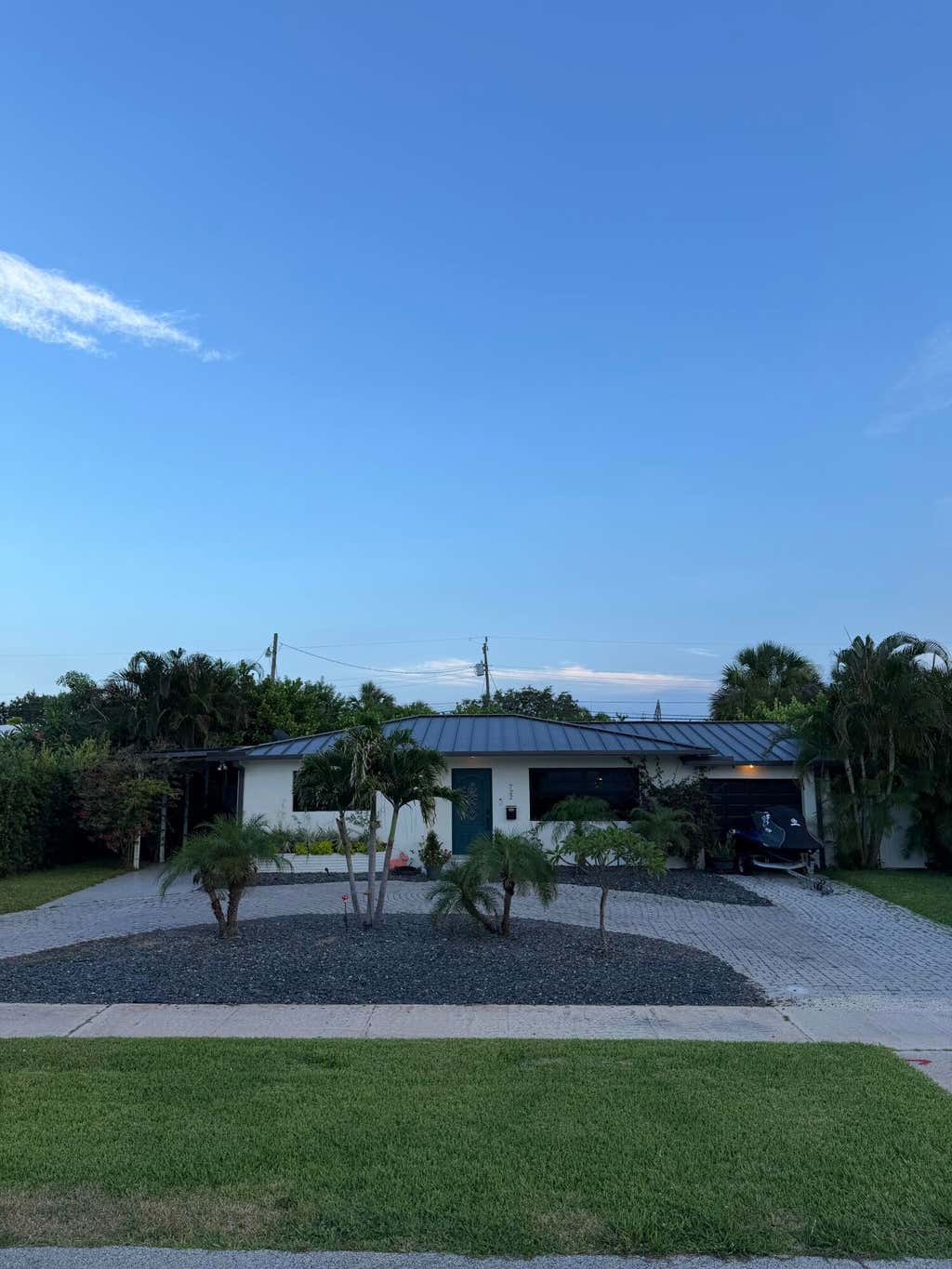 Photo of 722 Greenbriar Drive, Lake Park, FL 33403 (MLS # B26043382)