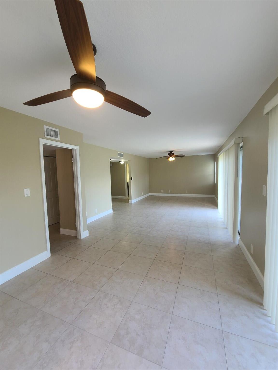 In the Heart of Fort Lauderdale! Beautifully updated 2-story, 2 bed, 2.5 bath condo featuring ceramic tile on the first floor and elegant laminate upstairs. Decorative ceiling fans throughout add style and comfort. The modern kitchen boasts newer stainless steel appliances, and both bathrooms have been fully renovated with sleek, contemporary finishes. Enjoy the convenience of an in-unit washer and dryer. Relax with tranquil views of the well-kept garden area. Open parking for 2 vehicles. Ideally located--walking distance to Fort Lauderdale Beach and just minutes from Lauderdale-by-the-Sea, Galleria Mall, restaurants, cafes, bars, and shops. Perfect for year-round living or as a vacation retreat. Don't miss this move-in ready gem!