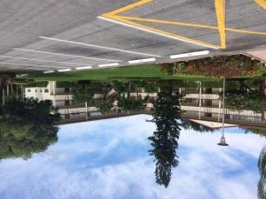 Rare C Model floor plan! Largest 1/1 floor plan and only 1 in each building. Unit needs total update and is priced accordingly. Balcony is approx 25' off living and dining room. Central A/C in unit.  Laundry room on each floor. Building is elevatored. View from living area overlooks beautiful lake with large mango tree in back. This unit has the potential to be fabulous! Century Village is an immaculately groomed and cared for community. Each community has their own pool.  Tennis courts are scattered throughout.  The HUGE clubhouse offers movies (free!)-shows in their 1500 seat theatre-classes-seminars-workshops-dances-outings-library-music room-and much more! Transportation available in community and out to public places.