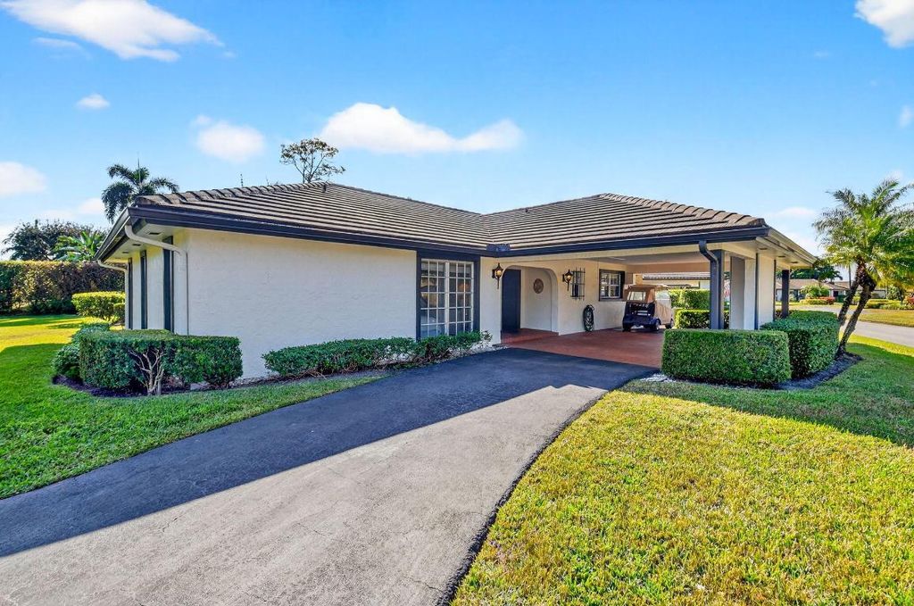 Photo of 440 Pine Villa Drive, Atlantis, FL 33462 (MLS # R11142494)