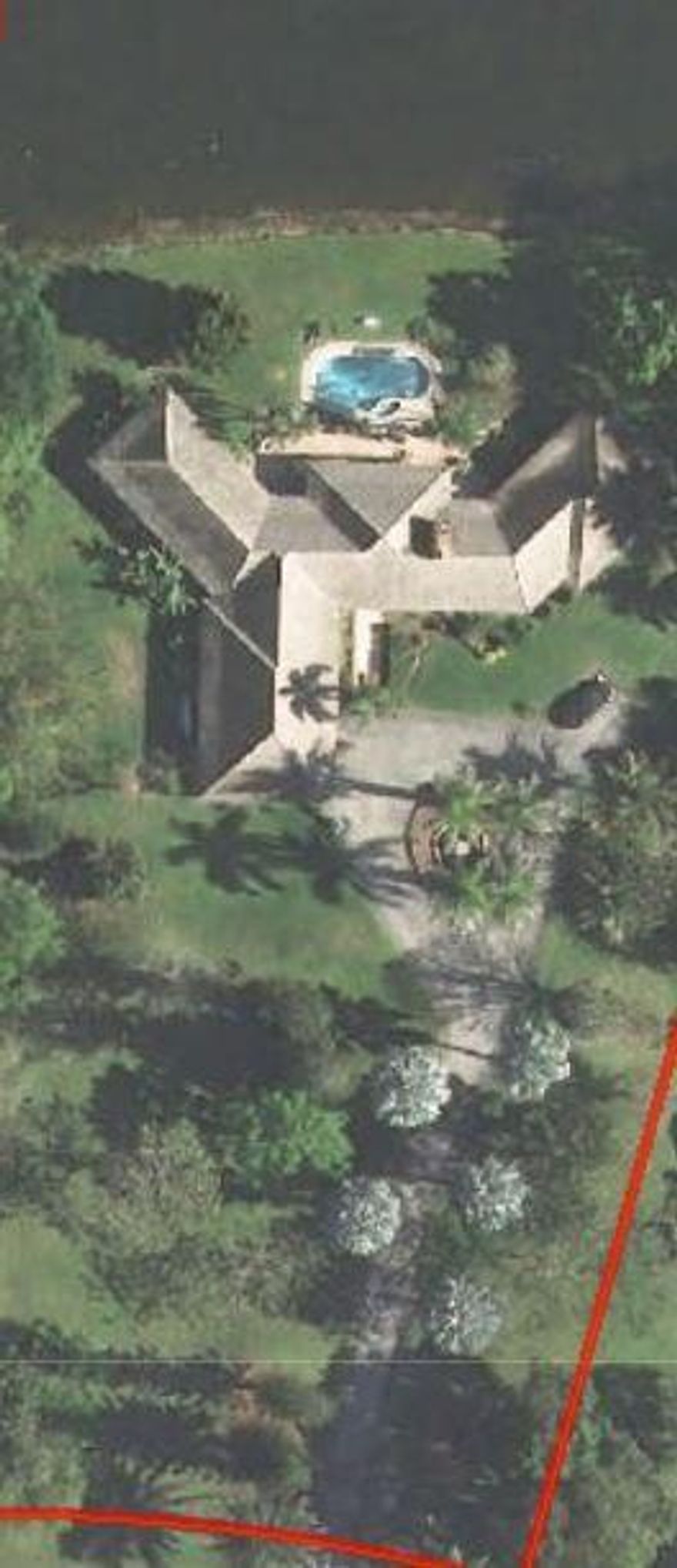 MUST SEE SPECIAL 4 Bedroom, 3 bath with two 1/2 baths, ONE STORY CUSTOM BUILT HOME! From the moment you enter the circular driveway w/fountain you will experience a one of a kind special home experience. Home is located on over two acres, with a pool overlooking a beautiful lake. Great views from every room. Large eat-in kit, 2 wood burning fire places, dramatic great room and large din. area. The home features crown moldings & coffer ceilings. This is an easy living home and great for entertaining.  Square footage is approximate.