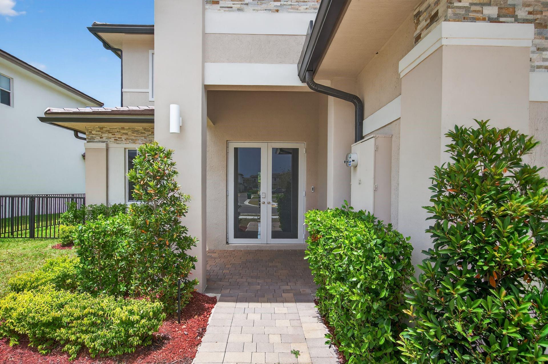 Why wait to build? Own this brand-new Scottsdale model in Crescent Ridge, Davie! Highly sought-after Next Gen design featuring 5 beds, 4.5 baths. The private Next Gen suite includes its own entrance, kitchenette, washer & dryer—perfect for guests, in-laws, or a home office. Porcelain tile in living areas, wood floors in bedrooms, impact windows, and electric blinds in the family room. Enjoy a stunning open kitchen with center island, quartz countertops, and stainless steel appliances. Move-in ready with modern finishes throughout!