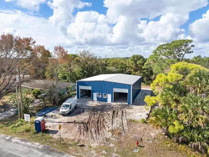 This brand-new 3,000± square foot steel warehouse, slated for delivery in early March 2026, offers a rare owner-user or investor opportunity in Fort Pierce with immediate proximity to Treasure Coast International Airport. The 50' x 60' clear-span layout supports a wide range of service, trade, and light industrial uses and features two 12-foot roll-up doors for efficient loading and vehicle access. The building is equipped with 400 amps of three-phase power to accommodate equipment-intensive operations. Situated on an approximately ¼-acre lot, the property includes usable yard space, on-site parking, and efficient circulation. With limited new construction industrial space under 5,000 square feet in the market, this asset presents a compelling own-versus-lease opportunity.