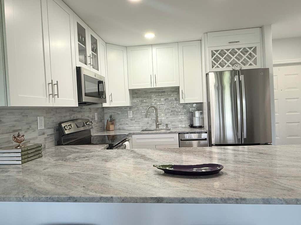 Photo of 401 Greensward Lane #102-a, Delray Beach, FL 33445 (MLS # B26033168)