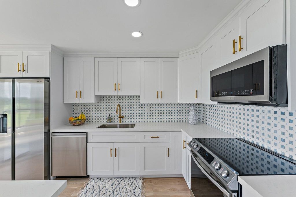 Photo of 5390 Woodland Lakes Drive #304, Palm Beach Gardens, FL 33418 (MLS # R10875610)