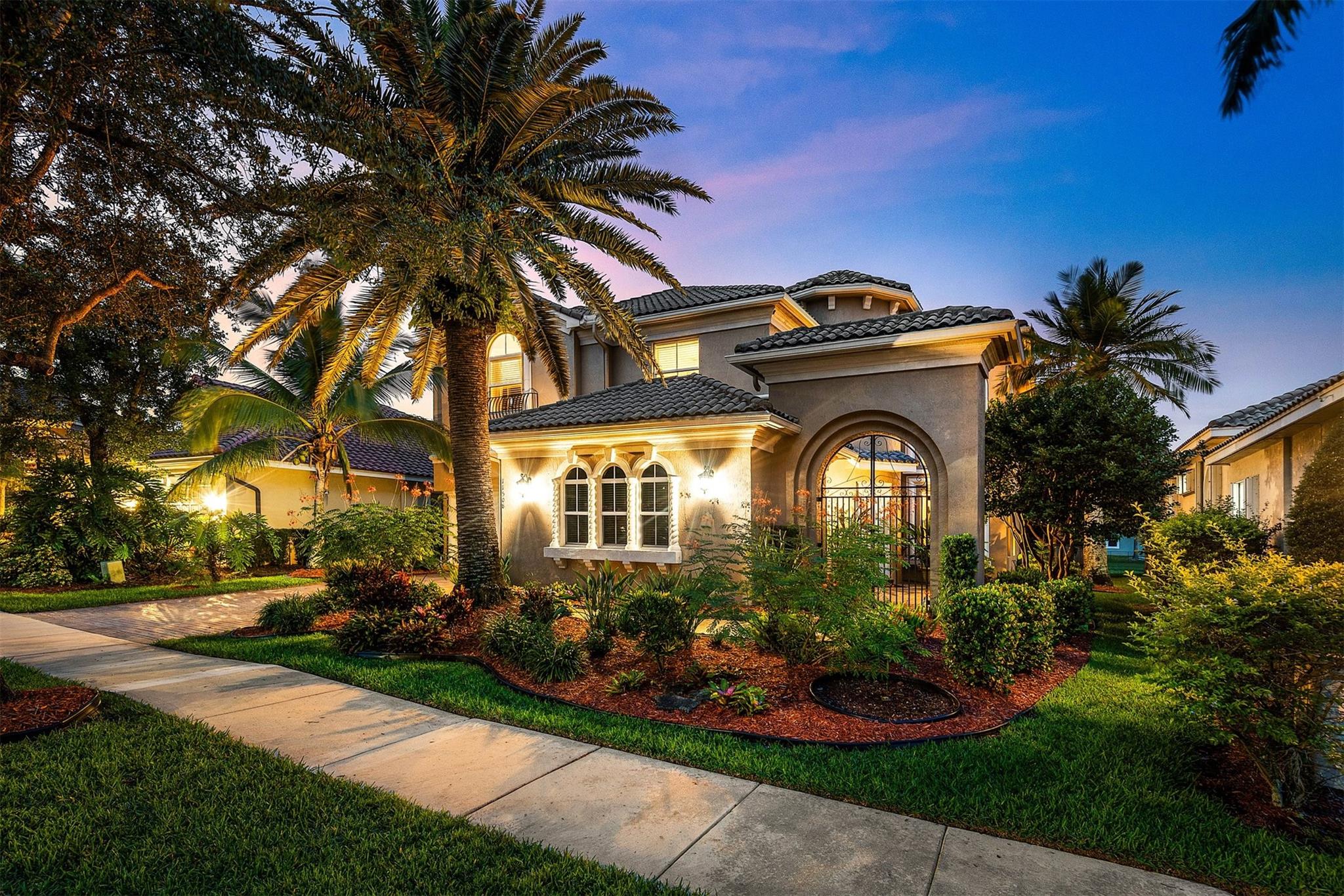 Magnificent opportunity to own this gem in prestigious Heron Bay! This meticulously maintained 4BR+office, 4BA home features soaring ceilings, elegant living & dining rooms, family room and a spacious kitchen with walk-in pantry—perfect for gatherings. Enjoy tranquil water views from your private tropical oasis with pool, hot tub, and mature mango & sapodilla trees. The luxurious primary suite boasts a sitting area, balcony, 2 custom walk-in closets, and spa bath with Jacuzzi tub & walk-through shower. Impact windows/doors, crown molding, tray ceilings & 3-car tiled garage. Sprinkler system pulls from the lake for lower water bill. Resort-style living with 2 clubhouses, pools, gyms, tennis, pickleball, basketball, walking trails, 3 gated entrances & more. Your dream home awaits!