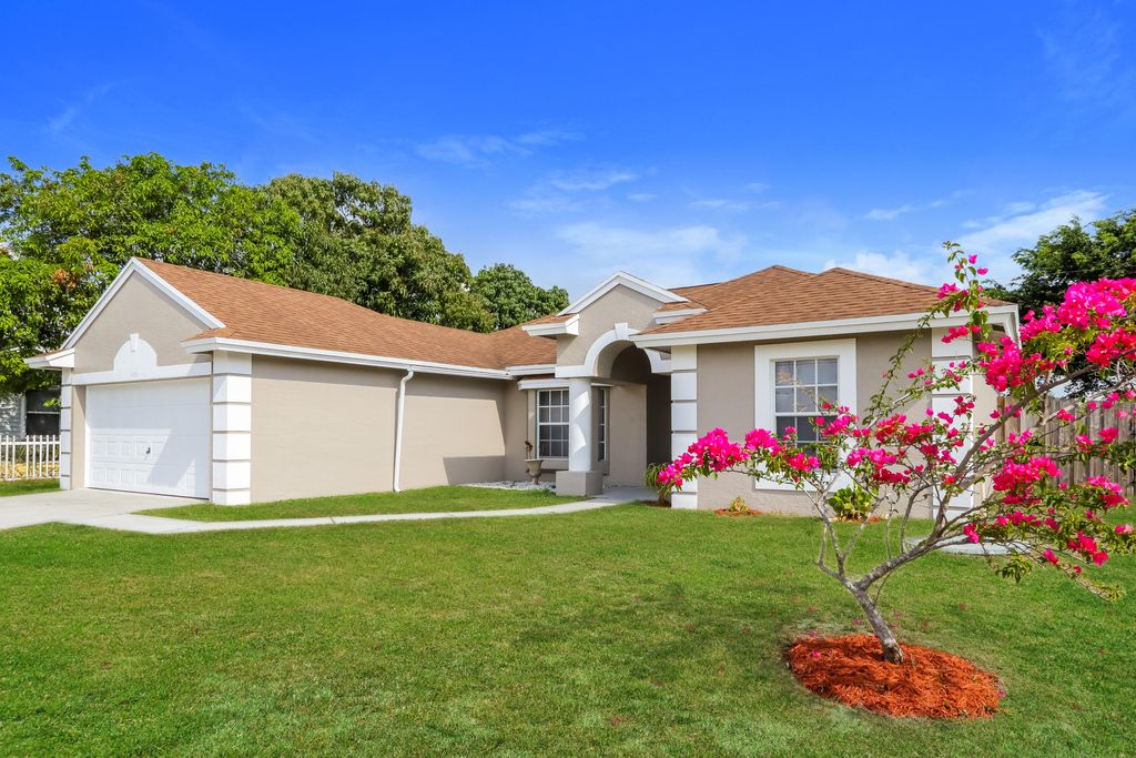 Photo of 459 SW Laconic Avenue, Port Saint Lucie, FL 34953 (MLS # B26028826)