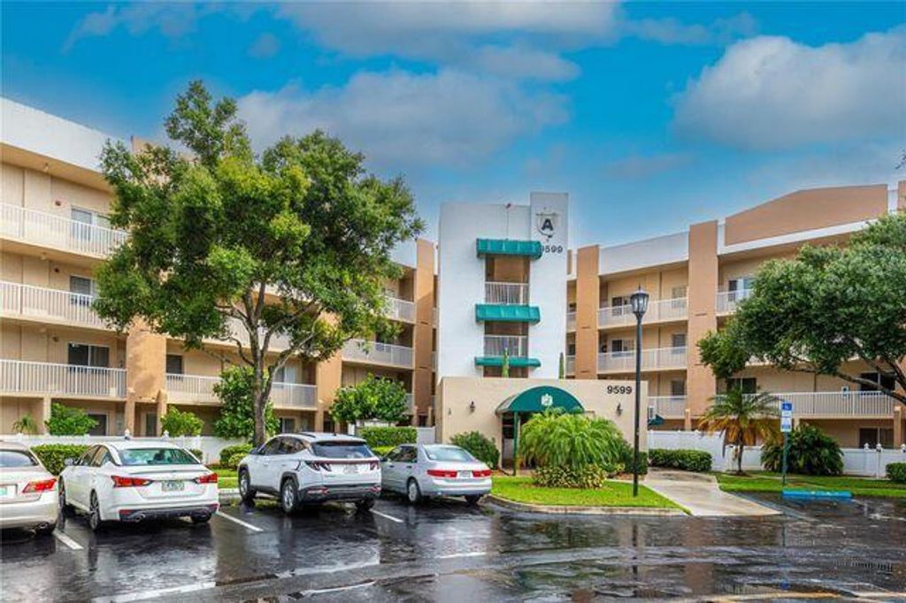 Photo of 9599 Weldon Circle #A203, Tamarac, FL 33321 (MLS # B26011934)