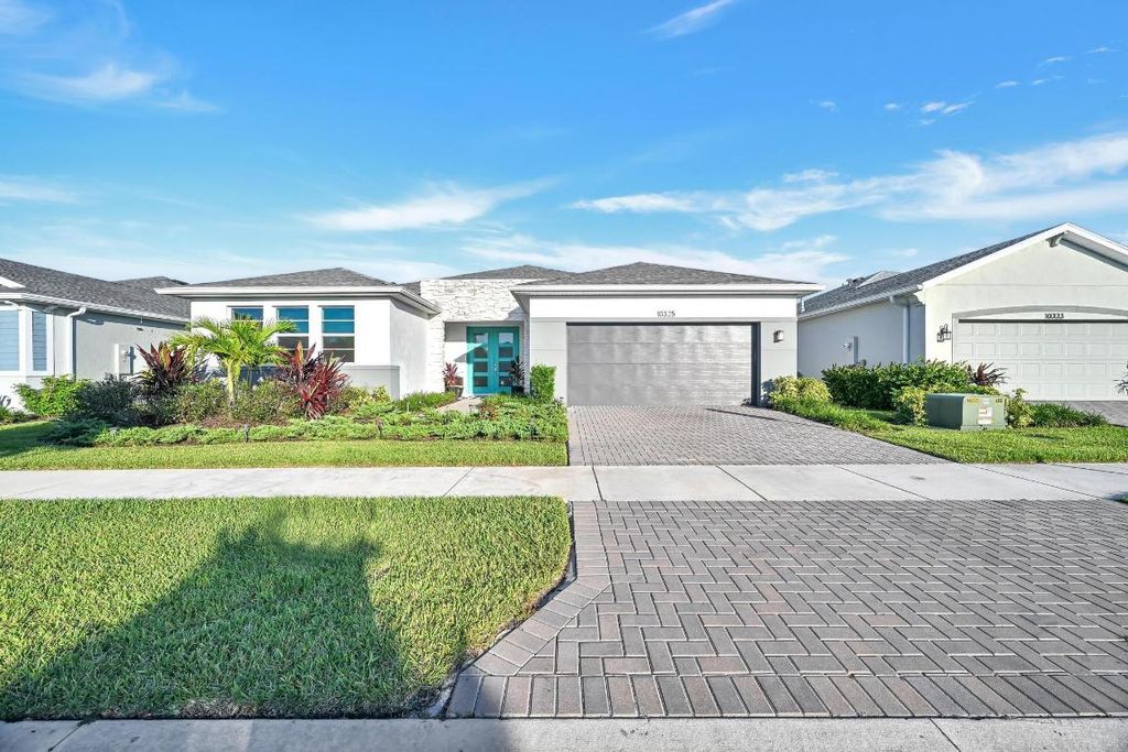 Photo of 10325 SW Phineas Lane, Port Saint Lucie, FL 34987 (MLS # R11138316)