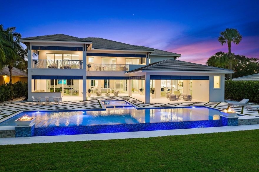 Brand new construction on the scenic Loxahatchee River in Jupiter, offering wide open water views and located on a .65-acre parcel. This 2-story residence features 5 bedrooms plus a theatre, club room, study, and a loft, as well as 7 1/2 baths, 2 laundry rooms, and an elevator. The first floor has an open concept flow overlooking the custom pool/spa, summer kitchen and the waterfront, with eastern exposure. A custom chef's kitchen boasts a double island, top-of-the-line appliances, and a huge pantry. The second floor has 4 bedrooms with en-suite baths plus a loft, including an impressive, oversized master bedroom and en-suite bath, leading to an expansive balcony with dramatic water views. A large, oversized 4-car garage. Private dock in the provides easy Intracoastal and Ocean access.