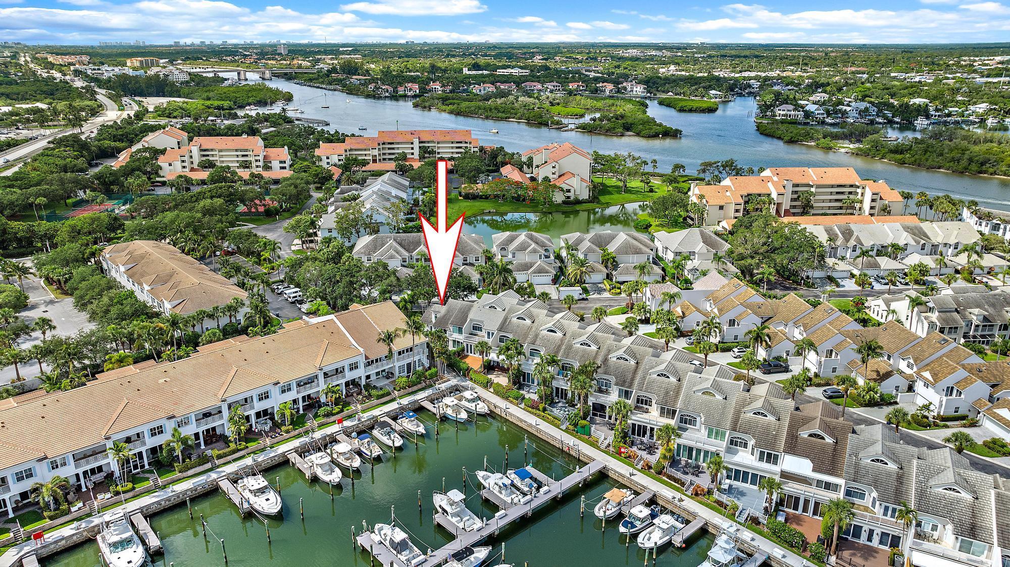 Available August-December 2025 and April 2026. Not Available for Jan-March 2026/ Modern, updated and furnished townhome available for rent in Jupiter Harbour overlooking marina. Updated kitchen with white shaker cabinets and white quartz countertops. New appliances and separate pantry. Laundry and additional refrigerator in garage. Master suite features first floor king bed with attached bath with double sinks, separate shower and tub and walk0in closet. First floor guest room with full bed and separate bathroom. Second floor has second living area, full bath and guest room with king bed.